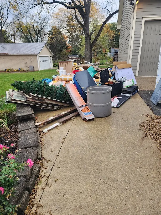 Dumpster being loaded with debris for Estate Cleanout Dumpster Rental in Ashland